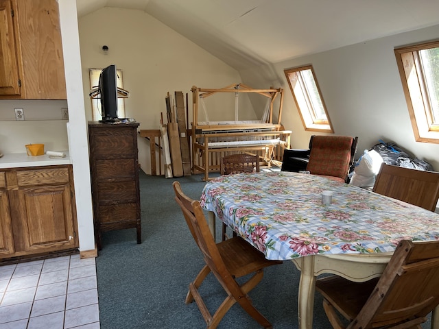 640 Bald Mountain Rd, Rangeley, ME 04970 - dining area featuring lofted ceiling and light tile patterned floors
