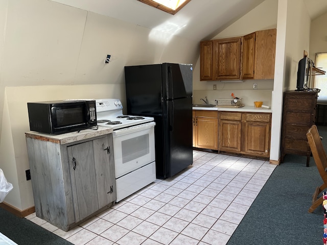 640 Bald Mountain Rd, Rangeley, ME 04970 - kitchen with black appliances, vaulted ceiling, light countertops, brown cabinets, and a sink