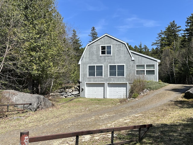 640 Bald Mountain Rd, Rangeley, ME 04970 - view of home's exterior with driveway and a gambrel roof