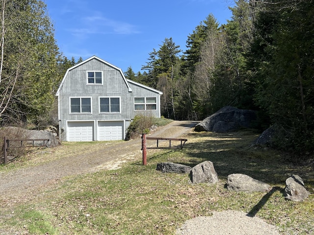 640 Bald Mountain Rd, Rangeley, ME 04970 - view of home's exterior with a gambrel roof and driveway