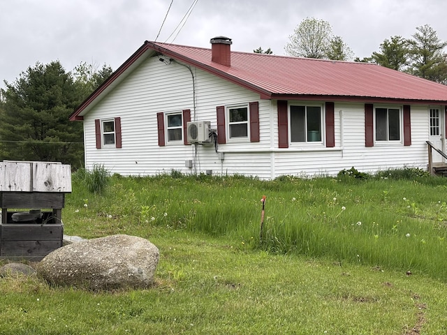 1407 Stage Rd, Etna, ME 04434 - view of side of home with a chimney and a metal roof