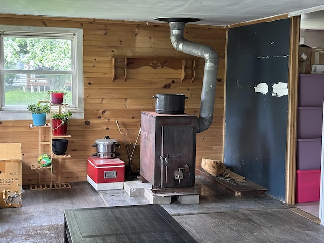 1407 Stage Rd, Etna, ME 04434 - detailed view of a wood stove, wood walls, and wood finished floors