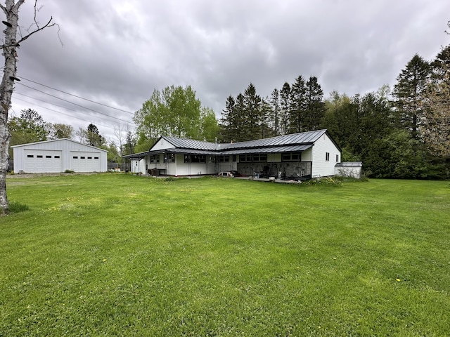 694 Calais Rd, Hodgdon, ME 04730 - view of green lawn with a garage and an outdoor structure