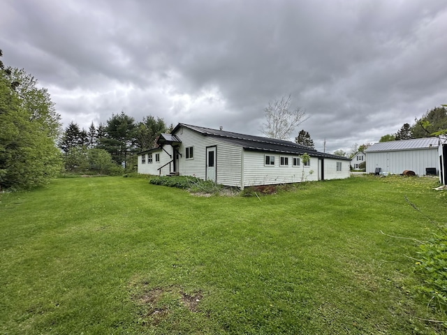 694 Calais Rd, Hodgdon, ME 04730 - rear view of property with a yard