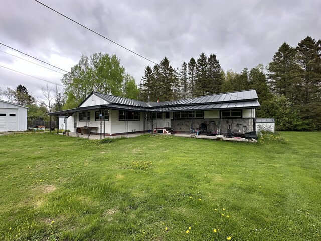 694 Calais Rd, Hodgdon, ME 04730 - view of front facade with a front lawn and metal roof