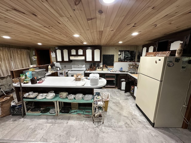 694 Calais Rd, Hodgdon, ME 04730 - kitchen featuring white appliances, under cabinet range hood, recessed lighting, and light countertops