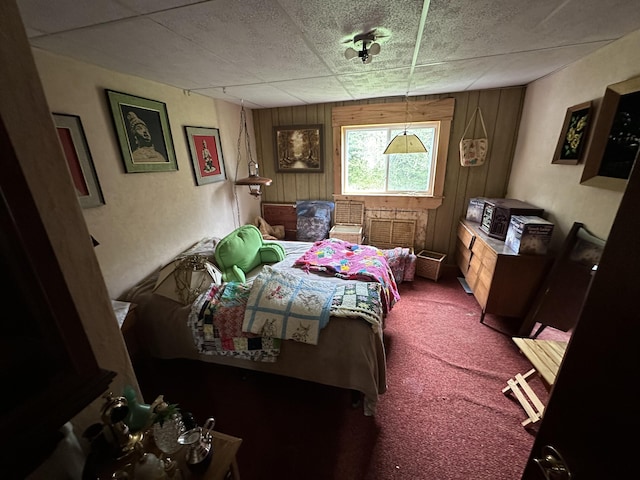 694 Calais Rd, Hodgdon, ME 04730 - carpeted bedroom with wood walls and a drop ceiling