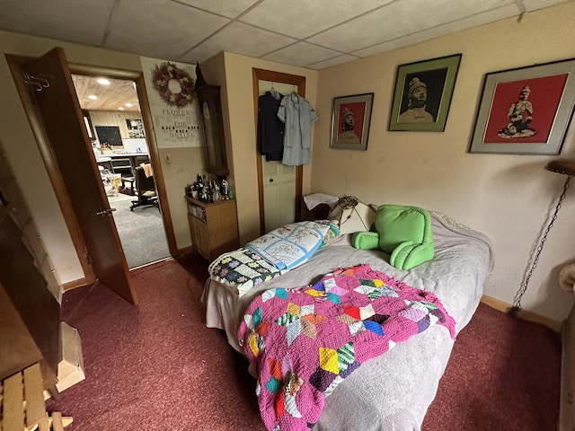 694 Calais Rd, Hodgdon, ME 04730 - carpeted bedroom featuring a drop ceiling and baseboards