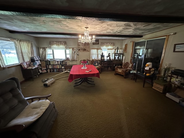 694 Calais Rd, Hodgdon, ME 04730 - carpeted dining area with a chandelier