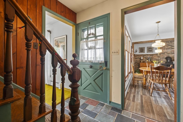 14 Lakeshore Dr, Belgrade, ME 04918 - entryway with brick wall, stairs, and a baseboard radiator