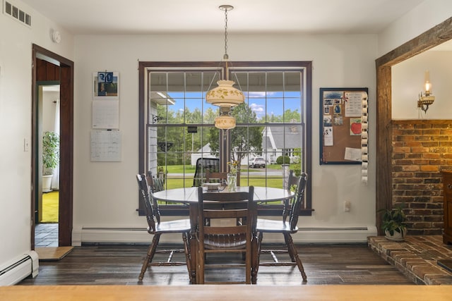 14 Lakeshore Dr, Belgrade, ME 04918 - dining space with a baseboard heating unit and dark wood-style floors