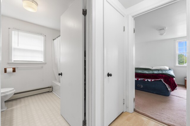 14 Lakeshore Dr, Belgrade, ME 04918 - full bathroom with a baseboard heating unit, toilet, shower / bathtub combination with curtain, and ensuite bathroom