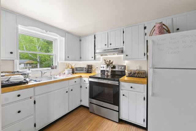 14 Lakeshore Dr, Belgrade, ME 04918 - kitchen featuring freestanding refrigerator, electric range, under cabinet range hood, a sink, and light wood-style floors
