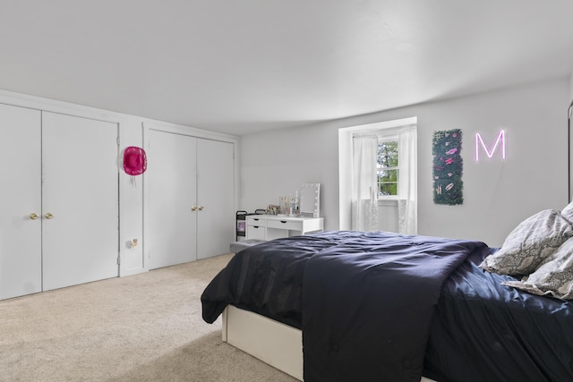 14 Lakeshore Dr, Belgrade, ME 04918 - bedroom featuring two closets and light carpet