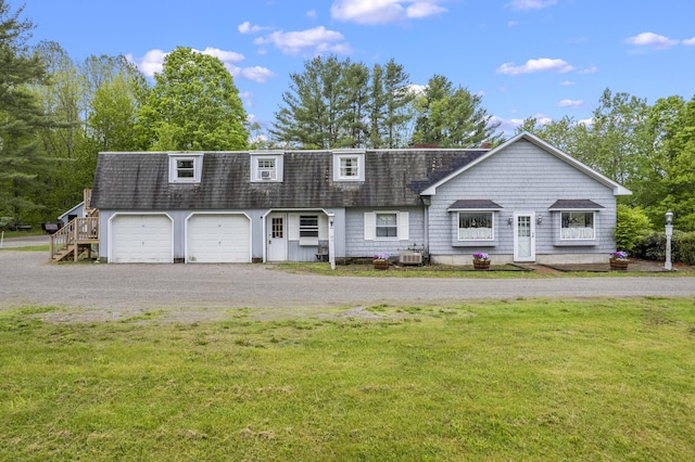 14 Lakeshore Dr, Belgrade, ME 04918 - view of front of property with a front lawn, driveway, a shingled roof, a garage, and central AC