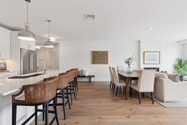 267 US Route 1 Unit 206, Falmouth, ME 04105 - dining room with light wood finished floors, recessed lighting, and baseboards