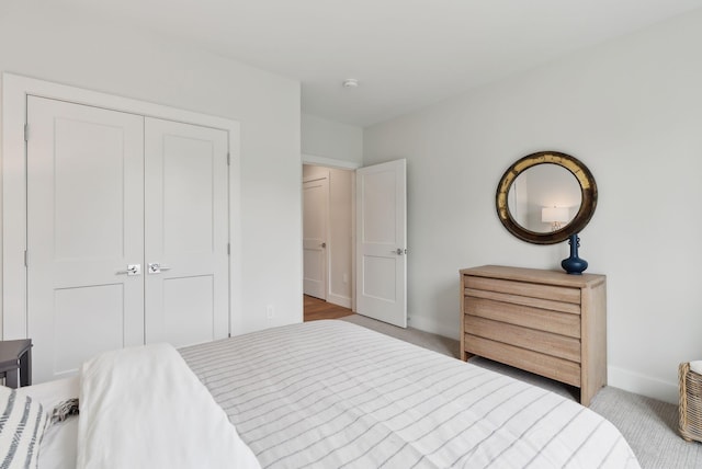 267 US Route 1 Unit 206, Falmouth, ME 04105 - bedroom with carpet floors, a closet, and baseboards