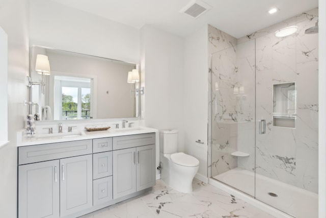 267 US Route 1 Unit 206, Falmouth, ME 04105 - full bathroom with a marble finish shower, double vanity, toilet, and marble finish floors