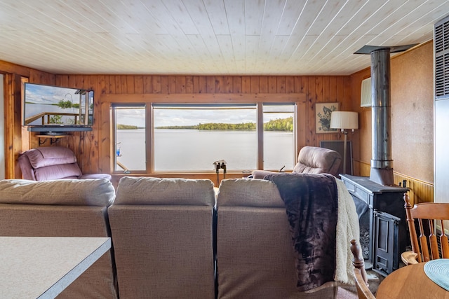 18 Breezy Knoll Dr, Princeton, ME 04668 - living room with wood walls, wood ceiling, a water view, and a wood stove