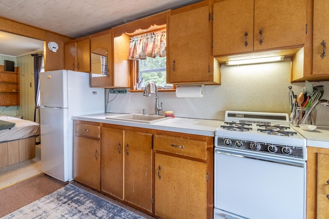 18 Breezy Knoll Dr, Princeton, ME 04668 - kitchen featuring white appliances, a sink, light countertops, and brown cabinets