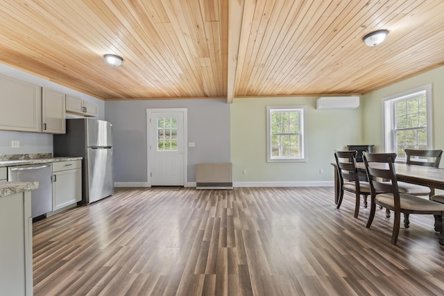 301 Pine Springs Rd, Shapleigh, ME 04076 - dining space featuring an AC wall unit, wooden ceiling, plenty of natural light, and dark wood finished floors