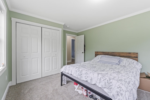 301 Pine Springs Rd, Shapleigh, ME 04076 - carpeted bedroom with crown molding, a closet, and baseboards