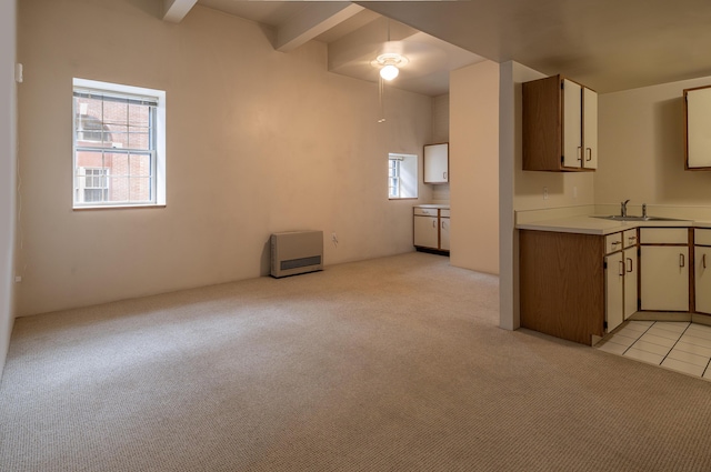 20 W St Unit 3, Portland, ME 04102 - kitchen with light colored carpet, plenty of natural light, a sink, beamed ceiling, and ceiling fan