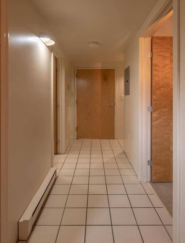 20 W St Unit 3, Portland, ME 04102 - hallway with a baseboard heating unit, electric panel, and light tile patterned flooring