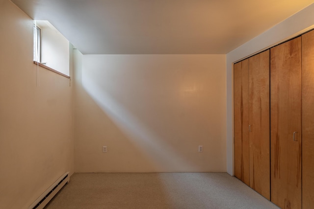 20 W St Unit 3, Portland, ME 04102 - unfurnished bedroom featuring a baseboard radiator, carpet floors, and a closet