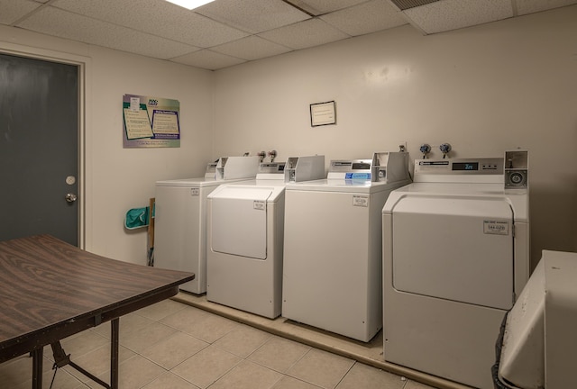 20 W St Unit 3, Portland, ME 04102 - community laundry featuring washing machine and dryer and light tile patterned flooring