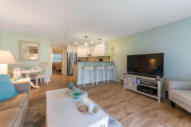 444 Main St Unit 110, Ogunquit, ME 03907 - living room featuring light wood-type flooring and baseboards