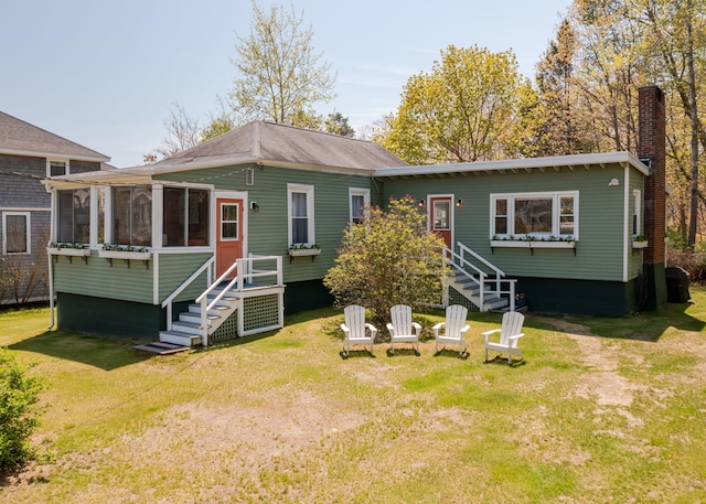 11 Saccarappa Ln, Scarborough, ME 04074 - rear view of property featuring a sunroom, a yard, and stairs