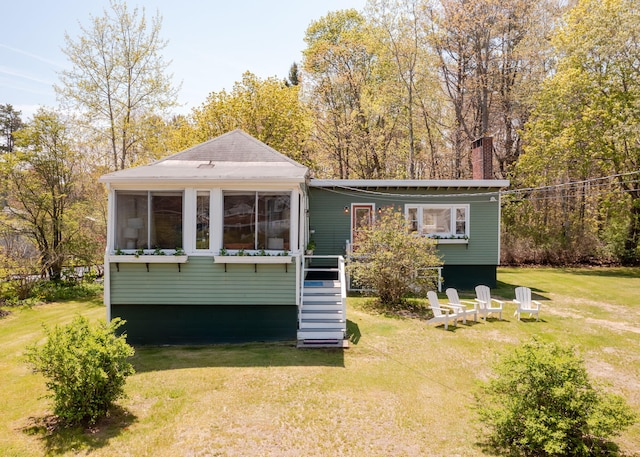 11 Saccarappa Ln, Scarborough, ME 04074 - rear view of property featuring a chimney and a yard