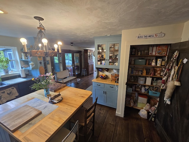 13 Bishop Farm Rd, Brownfield, ME 04010 - dining room with dark wood-style floors, plenty of natural light, and a chandelier