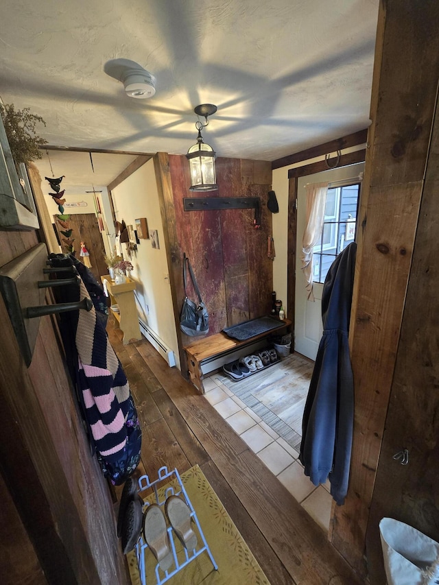13 Bishop Farm Rd, Brownfield, ME 04010 - interior space with wood-type flooring, baseboard heating, and wooden walls