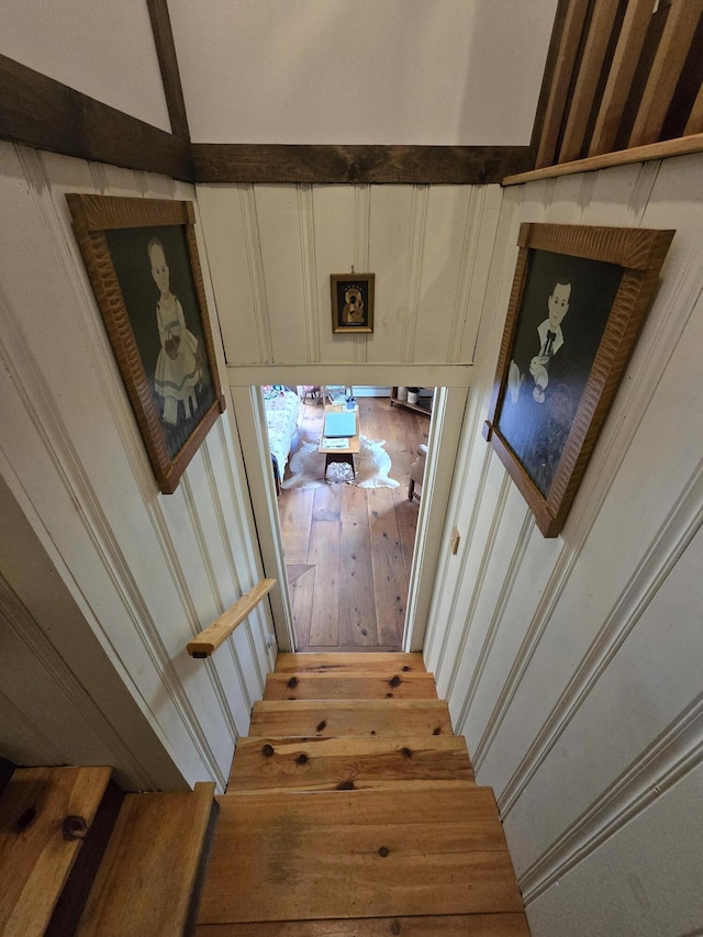 13 Bishop Farm Rd, Brownfield, ME 04010 - stairway featuring a decorative wall and hardwood / wood-style floors