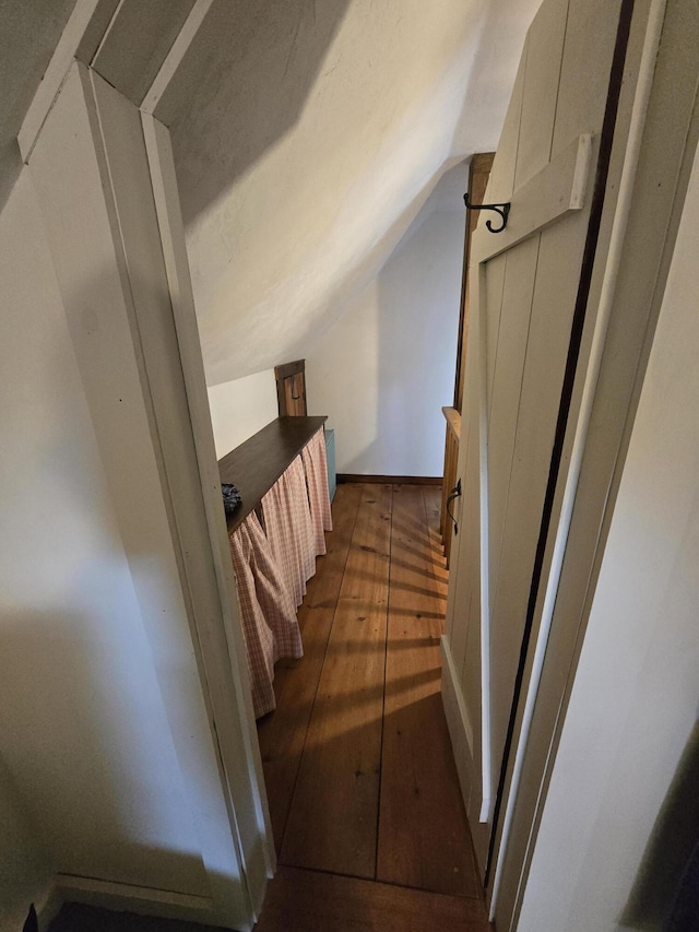 13 Bishop Farm Rd, Brownfield, ME 04010 - hallway with wood-type flooring and vaulted ceiling