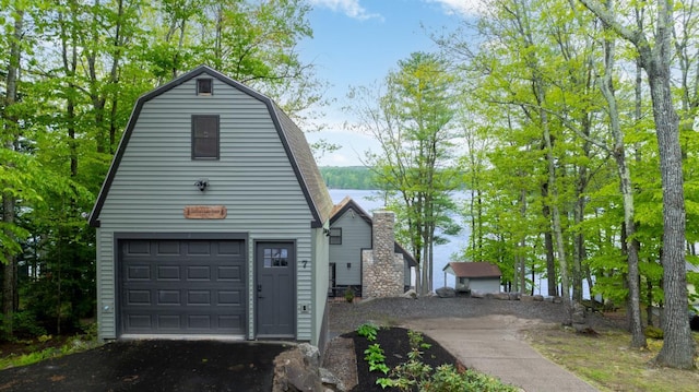 7 Scenic View Dr, Naples, ME 04055 - garage with a water view and asphalt driveway