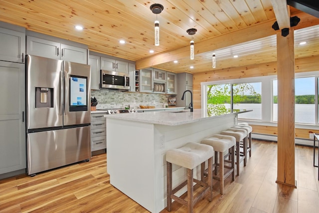7 Scenic View Dr, Naples, ME 04055 - kitchen with appliances with stainless steel finishes, gray cabinetry, a sink, recessed lighting, and light wood-style floors