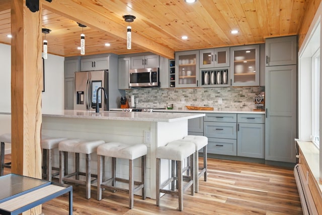 7 Scenic View Dr, Naples, ME 04055 - kitchen featuring wooden ceiling, stainless steel appliances, a kitchen bar, gray cabinets, and a baseboard heating unit