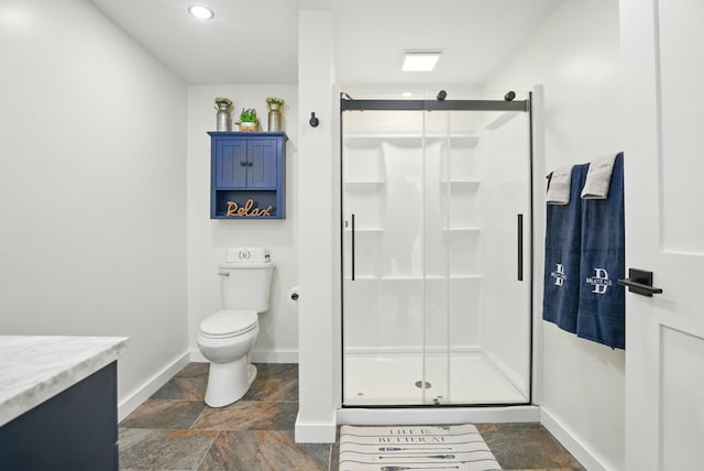 7 Scenic View Dr, Naples, ME 04055 - full bathroom featuring stone finish floors, baseboards, toilet, a stall shower, and vanity