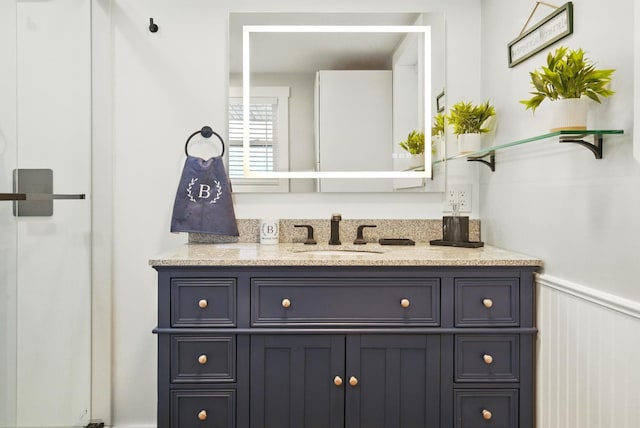 7 Scenic View Dr, Naples, ME 04055 - bathroom with vanity and a wainscoted wall