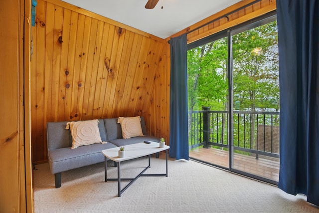 7 Scenic View Dr, Naples, ME 04055 - living area featuring wooden walls, ceiling fan, and carpet flooring