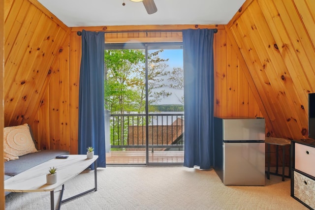 7 Scenic View Dr, Naples, ME 04055 - living area featuring carpet flooring, healthy amount of natural light, wooden walls, and a ceiling fan