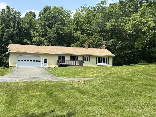 270 Mccrillis Corner Rd, Wilton, ME 04294 - ranch-style house featuring an attached garage, asphalt driveway, a chimney, a front yard, and a wooden deck