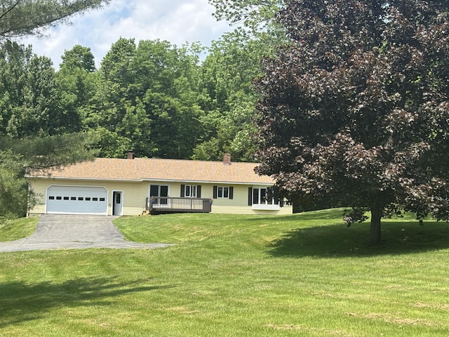 270 Mccrillis Corner Rd, Wilton, ME 04294 - ranch-style house featuring an attached garage, asphalt driveway, a front yard, and a wooden deck