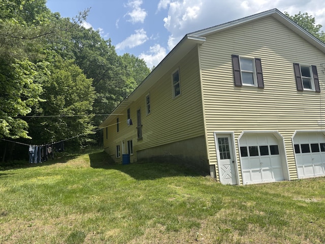 270 Mccrillis Corner Rd, Wilton, ME 04294 - view of property exterior with an attached garage and a yard