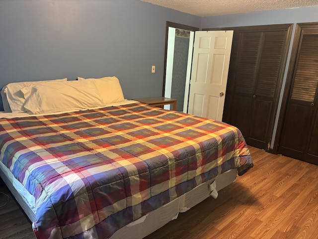 270 Mccrillis Corner Rd, Wilton, ME 04294 - bedroom with light wood finished floors and a textured ceiling