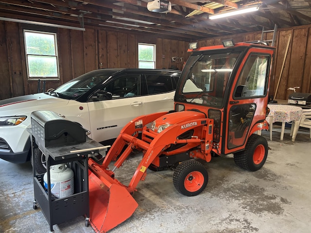 270 Mccrillis Corner Rd, Wilton, ME 04294 - garage with a garage door opener and wood walls