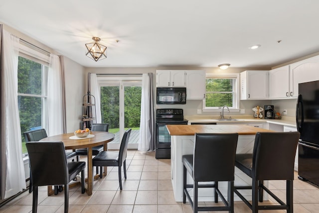 7 Apple Ledge Dr Unit 7A, Portland, ME 04103 - kitchen featuring black appliances, a sink, white cabinetry, light tile patterned floors, and recessed lighting